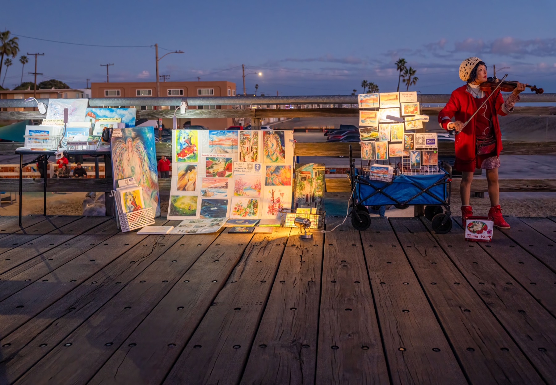 Local violinist and artist display on the Seal Beach pier